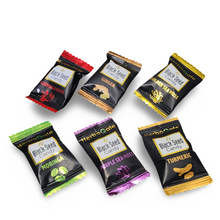 Assorted black seed candy packages on a white background