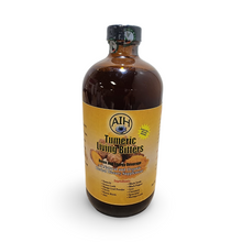 Bottle of Tumeric Living Bitters with a yellow label on a white background